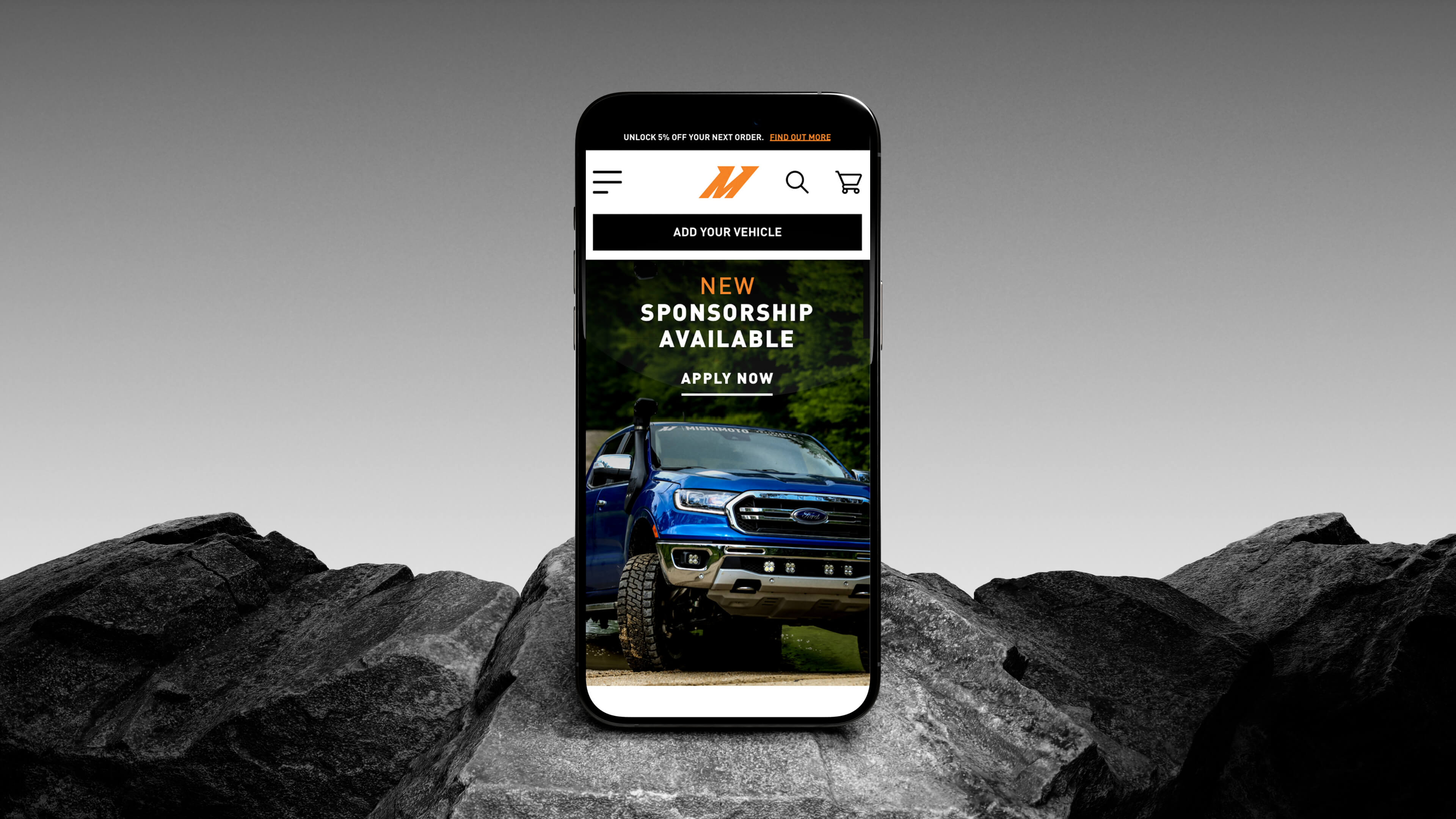 Mishimoto mobile iphone design on rocky background